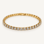 Gold-tone bracelet on an ivory background
