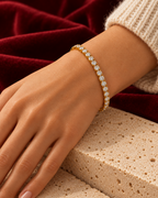 Gold-tone bracelet worn — AI-generated styled image