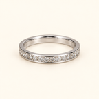Simple silver-tone band on an ivory background