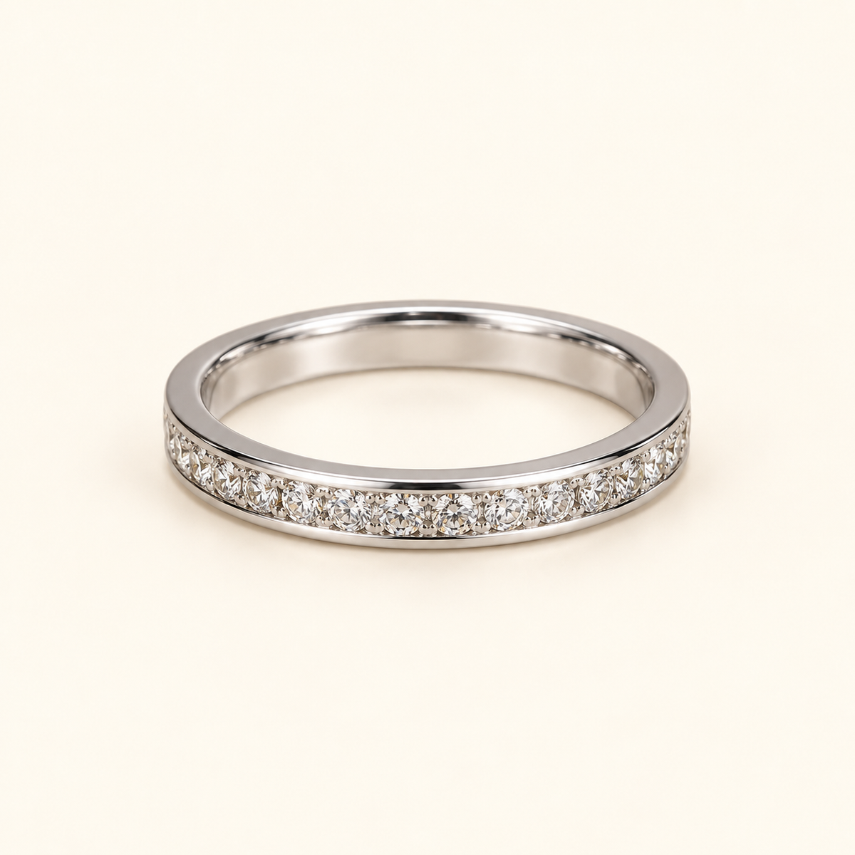 Simple silver-tone band on an ivory background
