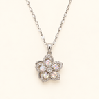 Flower necklace with white rhinestones on an ivory background