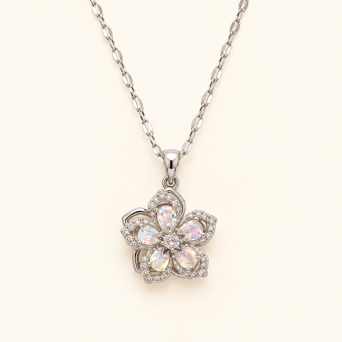 Flower necklace with white rhinestones on an ivory background