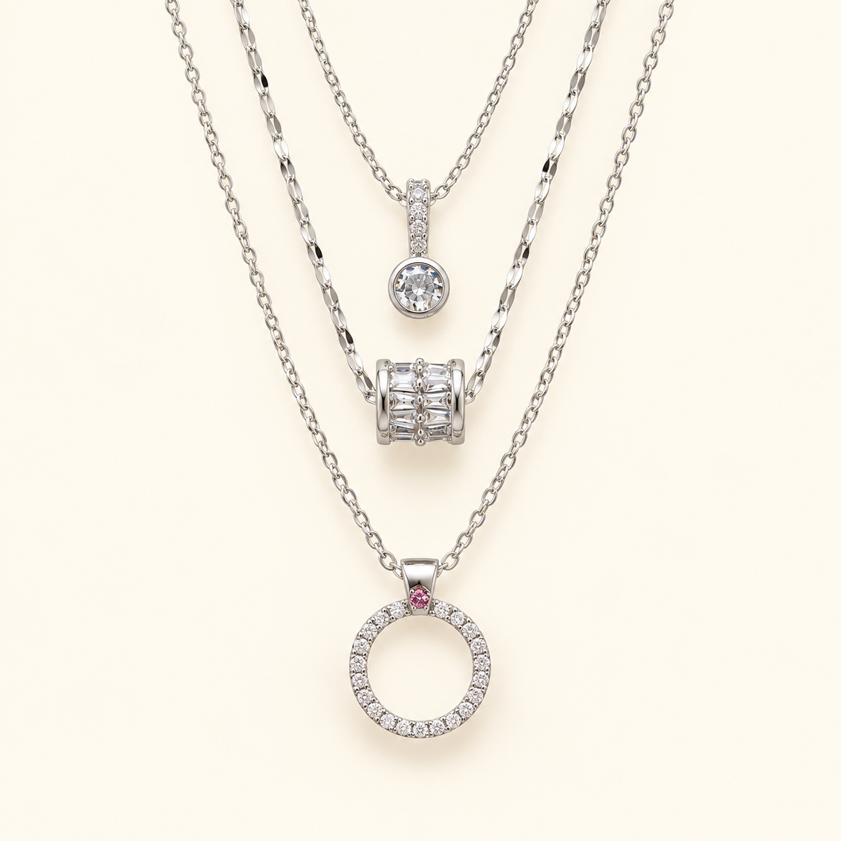 Triple necklace on an ivory background