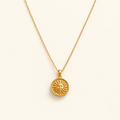 Kappa necklace on an ivory background