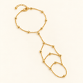 Crista hand chain on an ivory background